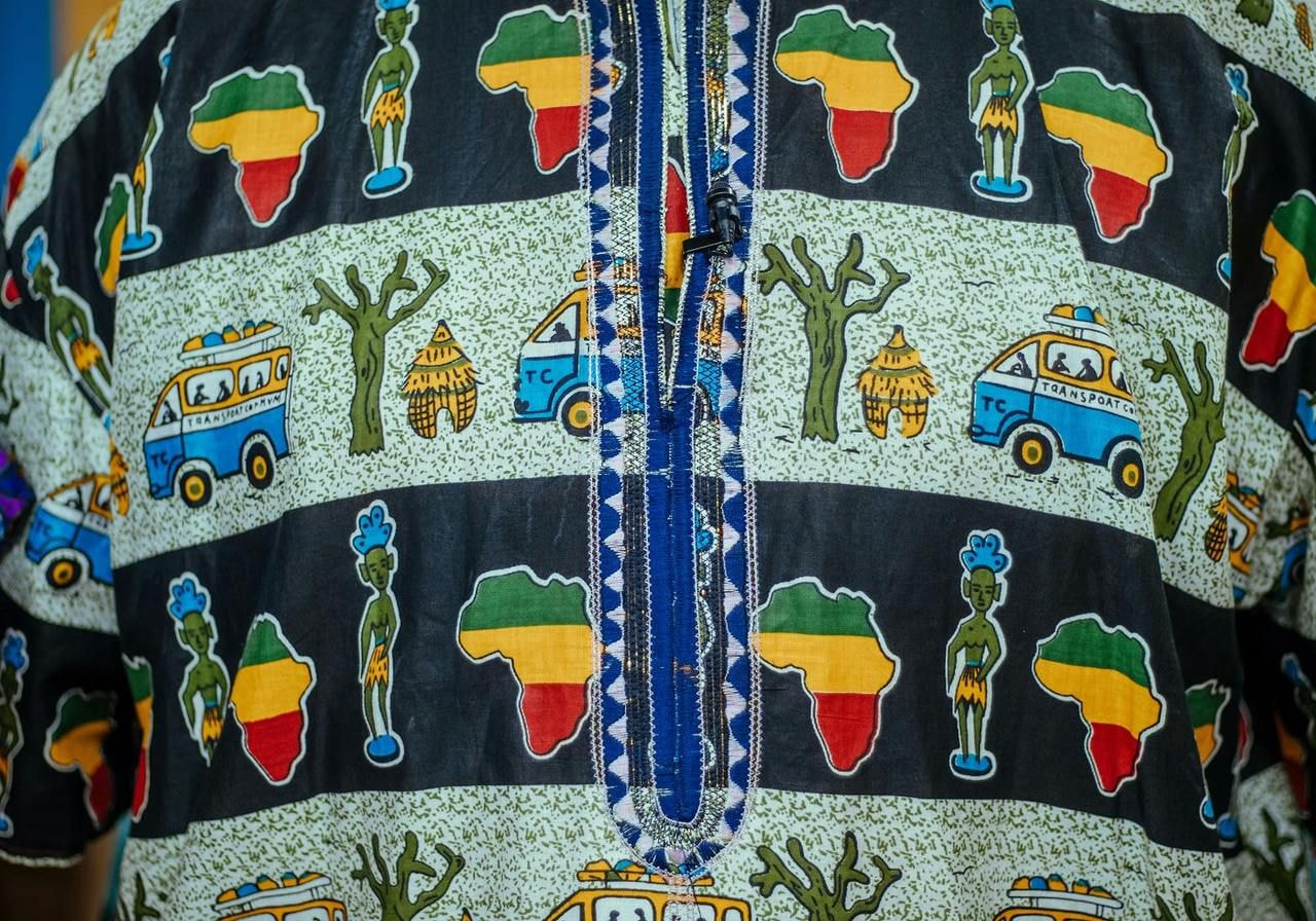 A shirt featuring a vibrant, colorful design that adds a lively touch to casual wear.